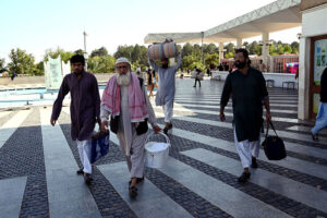 People arriving with their luggage for Itikaf at Faisal Masjid.