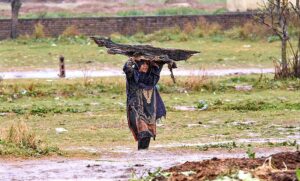 Motorcyclists and vehicles on their way at Islamabad Expressway during rain that experienced the Federal Capital