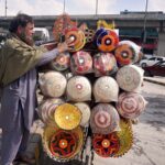 A vendor displaying and selling handmade bread baskets to attract customers