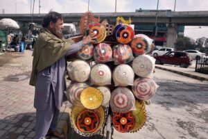 A vendor displaying and selling handmade bread baskets to attract customers