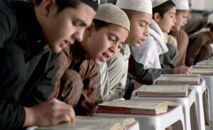 Madrassa Students reciting Holy Quran during Holy Fasting Month of Ramadan at Jamia Masjid Qazi Nizamuddin near Bani Chowk, This Historic Masjid under the administration of Hazrat Maulana Qari Syed Moinuddin Shah Sahib Established since 1966.