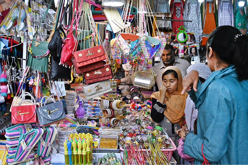 Families shopping for upcoming Eid al-Fitr celebrations in Karachi Company Market