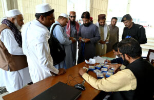 People arriving with their luggage for Itikaf at Faisal Masjid.