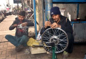 A vendor displaying and selling handmade bread baskets to attract customers