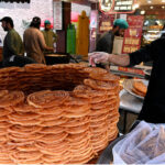 Vendor displaying traditional sweet item (Jalebi) for iftar at Karachi Company during Holy month of Ramadan in the Federal Capital