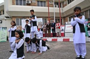 School Student volunteers performing on the occasion of Flag Hoisting in the presence of Secretary General PRCS, Abaid Ullah Khan, Representatives from Humanitarian organisations, Civil Society, Lawyers, Teachers and others -Staff of PRCS, IFRC, ICRC, Norwegian Red Cross, Turkish Red Crescent, German Red Cross and Volunteers at Pakistan Red Crescent Society, National Headquarters.