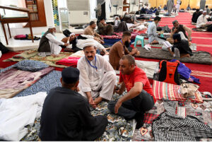 People arriving with their luggage for Itikaf at Faisal Masjid.