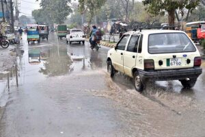 A vehicle passing through rain water accumulated on road after heavy rain that experienced the Twin Cities