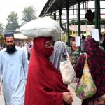 People purchasing vegetables at Sasta Ramadan bazaar Aabpara.