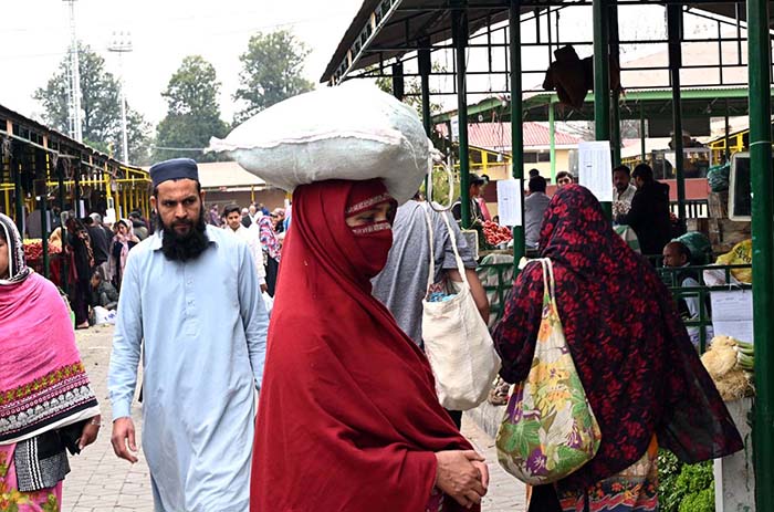 People purchasing vegetables at Sasta Ramadan bazaar Aabpara.