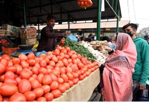 A vendor selling dates during holy fasting month of Ramadan at sasta Ramzan Bazar Abpara in the Federal Capital