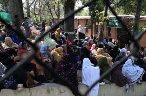 A large number of women standing in a queue to draw money from Benazir Income Support Programme (BISP) beneficiaries outside Benazir One Window Center at G-7.