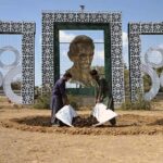 CDA gardeners spreading fertilizer for planting saplings at roadside greenbelt in Federal Capital.