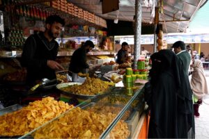 A vendor selling dates during holy fasting month of Ramadan at sasta Ramzan Bazar Abpara in the Federal Capital
