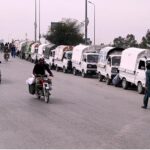 A large number of Suzuki cabs waiting for passengers at khana pull