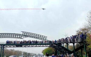 People watching Aerobatic aircrafts taking part in a rehearsal for Pakistan Day celebration show at Shakarparian area in the Federal Capital