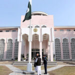 Ambassador of Pakistan to China, Khalil Hashmi raising the Pakistan flag at the ceremony to mark the national day hosted by Pakistan Embassy