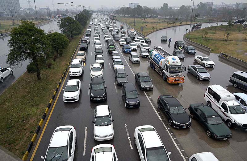 A view of massive traffic jam at Islamabad Expressway during rain that experienced the Federal Capital