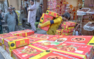 Customers busy in purchasing dates for Iftar during the holy month if Ramazan at Raja Bazaar market.