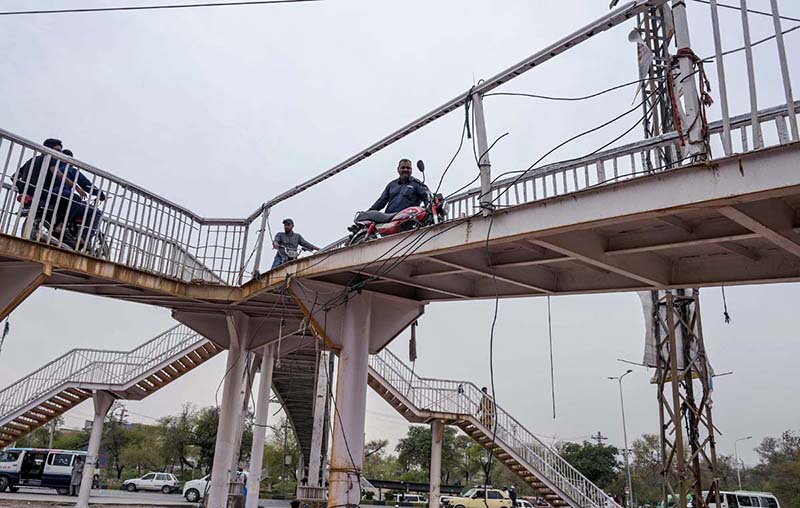 A view of a damaged pedestrian bridge at Kuri Road.