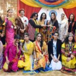 Famous TV artist Leyla Zuberi giving prizes to winners of Regional Dress fashion show organized in connection with Students Week celebrations held at FG Home Economics College F11/1