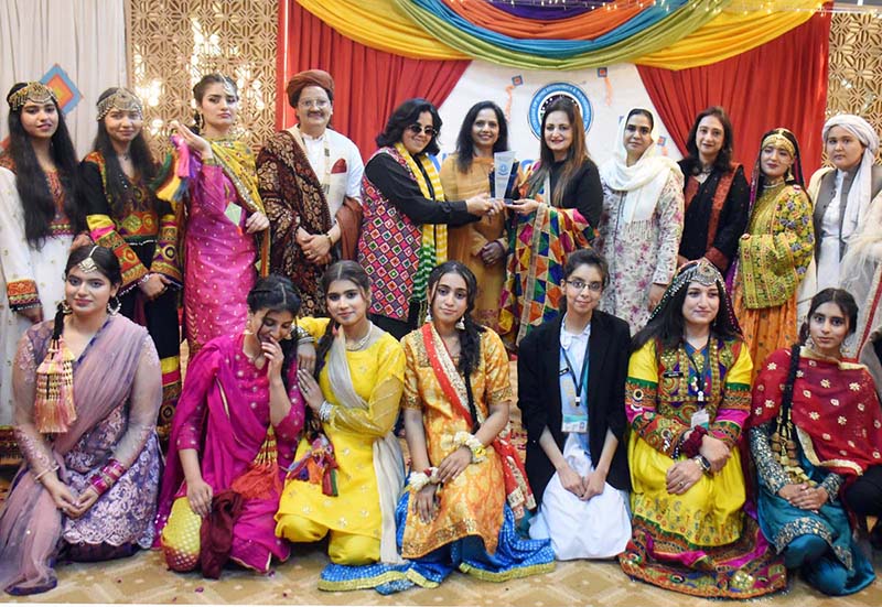 Famous TV artist Leyla Zuberi giving prizes to winners of Regional Dress fashion show organized in connection with Students Week celebrations held at FG Home Economics College F11/1