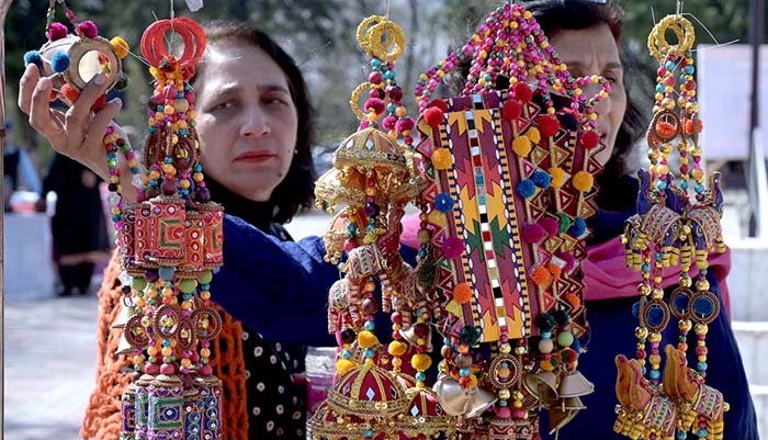 Women visiting stalls at 10th National Women at Work commemorating International Women's Day organised by Lok Virsa with the collaboration of Devcom-Pakistan and dtn.