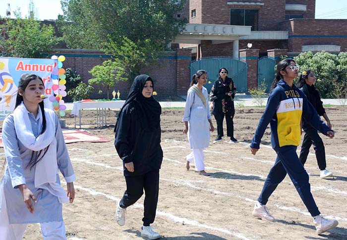 Students participating in different games during Annual Sports Gala of Government Graduate College Home Economics.