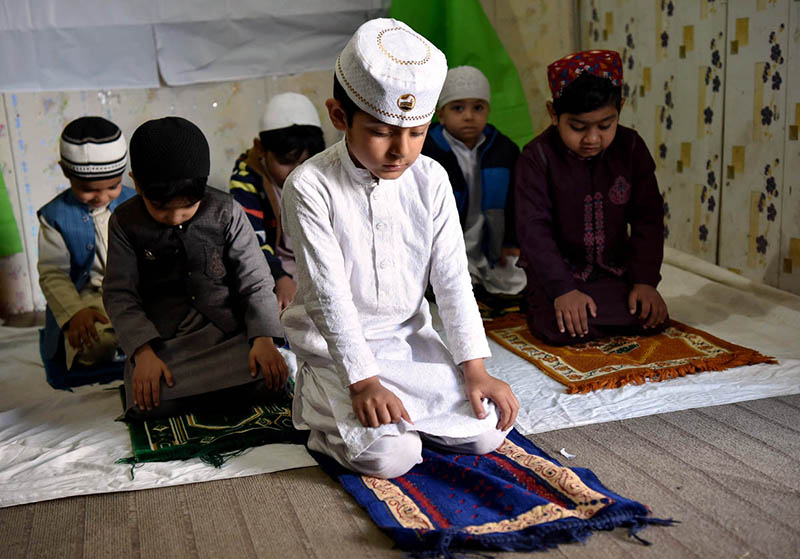 Students of Private School offering Prayer during School Motivated Activity of Holy Fasting Month of Ramadan at Dosehra Ground