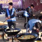 Volunteers preparing iftar for deserving people at roadside