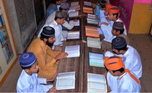 Madrasa students reciting Holy Quran in a mosque during Holy Fasting Month of Ramadan.