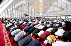 An aged person attends congregation prayer (Friday Prayer) at Faisal Masjid in the holy fasting month of Ramzan.