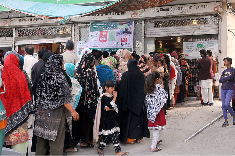 A large number of Women in a queue to get flour on Government subsidized rate from utility store