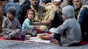Volunteers serving iftar for deserving people at Eidgah Sharif.
