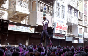 Hindu girls celebrates religious ritual Holi, the Spring Festival of Colors at Durgah Shiva Mandir.