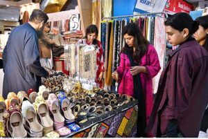 Women purchasing jewelry during Eid shopping in preparation of upcoming Eid-ul-Fitar.