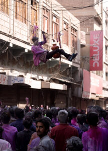 Hindu girls celebrates religious ritual Holi, the Spring Festival of Colors at Durgah Shiva Mandir.