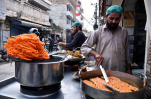 People purchasing traditional food items for iftar during Holy fasting month of Ramadan.