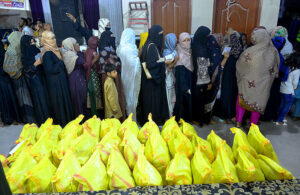 Volunteers distribution ration bags to deserving people donate by jilani welfare foundation during Holy fasting month of Ramadan at Latifabad.