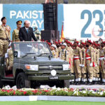 President Asif Ali Zardari observes the military parade during the Pakistan Day Parade ceremony, at Shakarparian Parade Ground