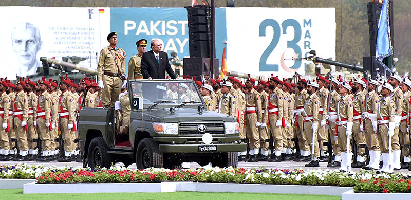 President Asif Ali Zardari observes the military parade during the Pakistan Day Parade ceremony, at Shakarparian Parade Ground