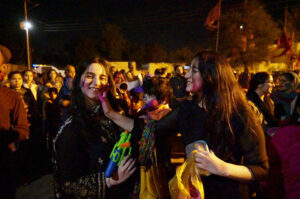 Hindu girls celebrates religious ritual Holi, the Spring Festival of Colors at Durgah Shiva Mandir.