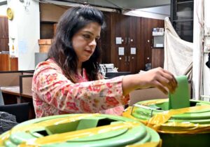 A voter cast her vote during the APP Employees Union Election- 2024 at APP Headquarters.