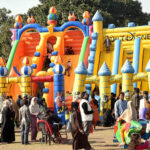 Children are enjoying on jumping castle during Jashan Baharan Festival at Jilani Park