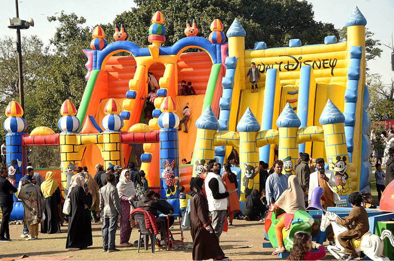 Children are enjoying on jumping castle during Jashan Baharan Festival at Jilani Park