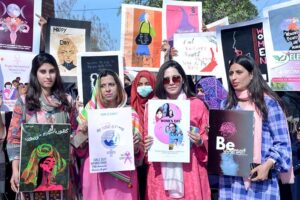 Students participating in scooty march and walk to mark International Women's Day at Government College for Women University (GCWUF) Madina Town.