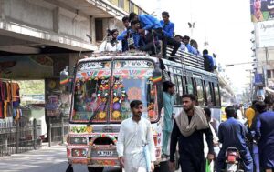Students sitting on the roof of bus in a dangerous way may cause any mishap and need attention of concerned authority at Noori Phatak.