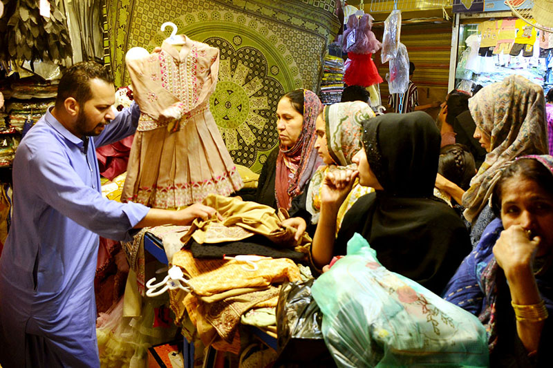 Women busy in Eid shopping at Resham Bazaar during upcoming Eid-ul- Fitr celebrations.