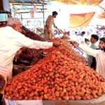 People selecting and purchasing the dates ahead of the holy fasting month of Ramadan at Tower market.