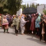 A large number of women in a queue to get flour bag on subsidies rate